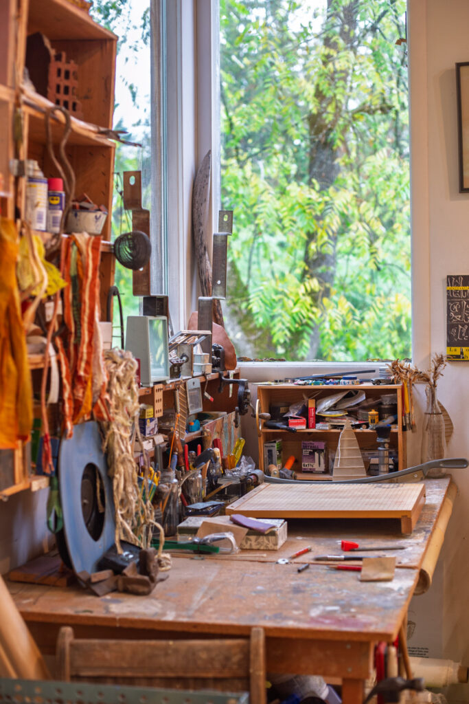 Art studio workspace in front of window